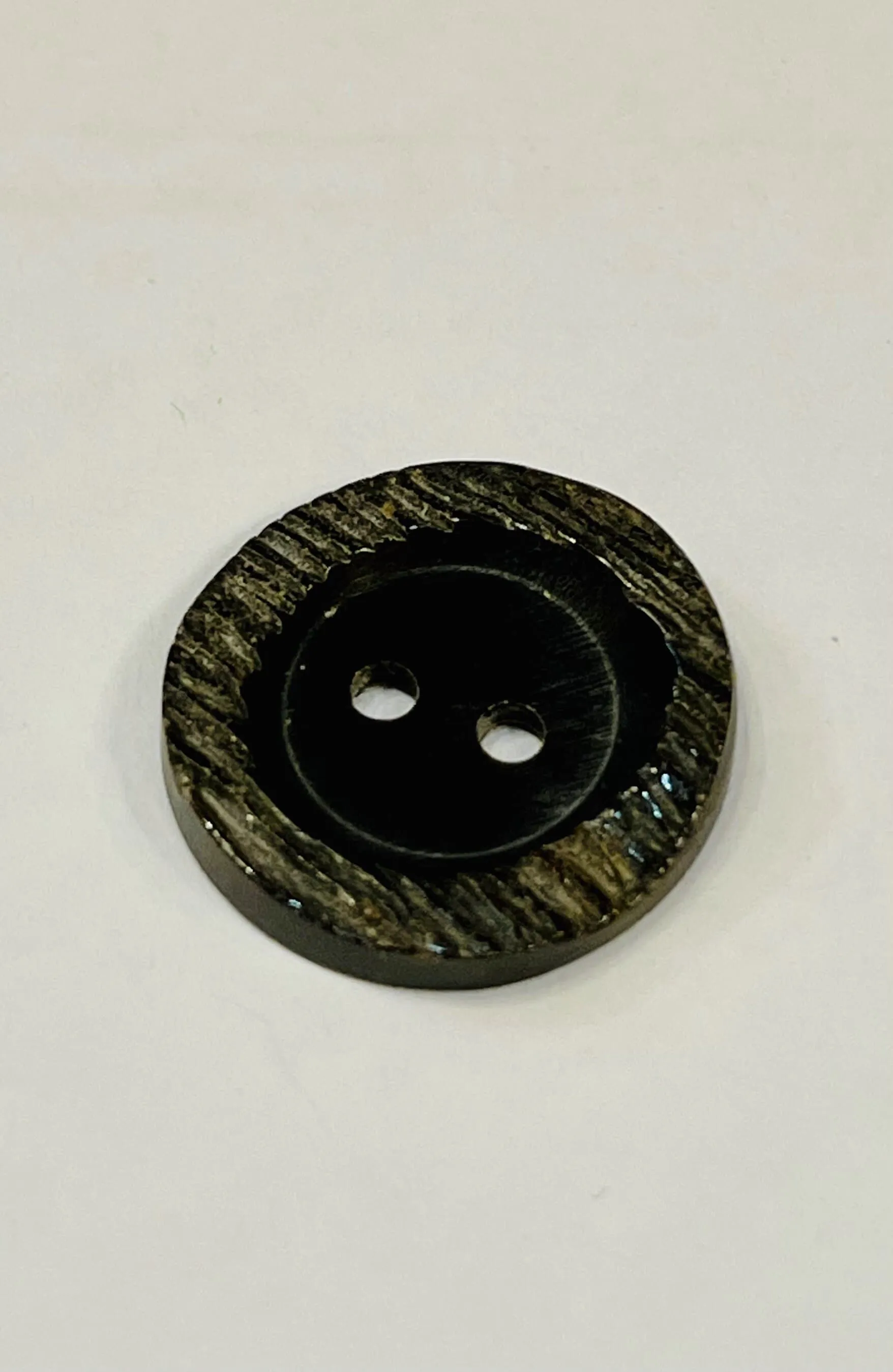 Black horn button
